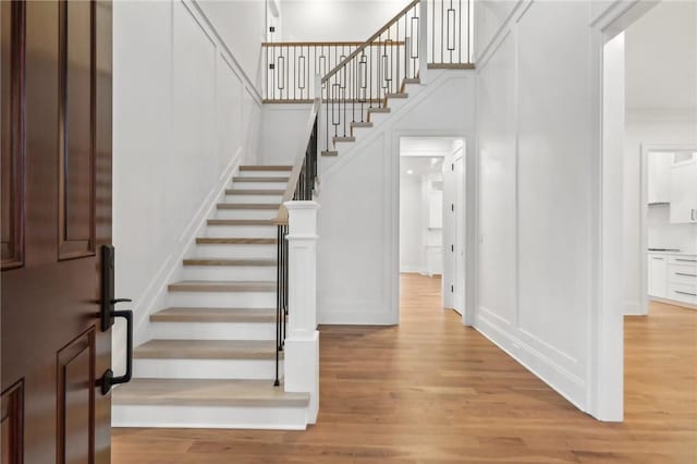 stairway featuring hardwood / wood-style flooring