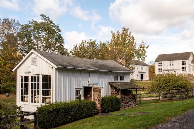 view of outbuilding with a lawn