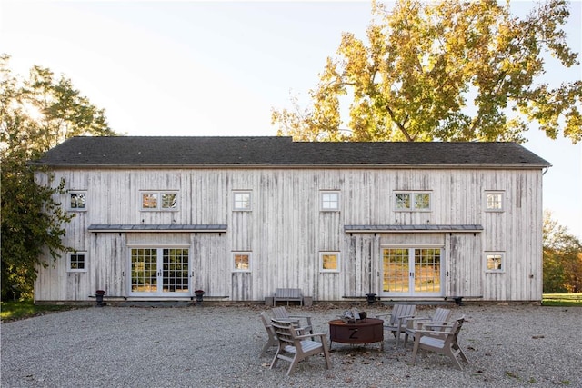 back of house featuring a fire pit and a patio area