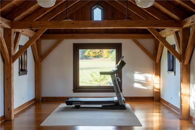 workout area with wood ceiling, lofted ceiling, and hardwood / wood-style flooring