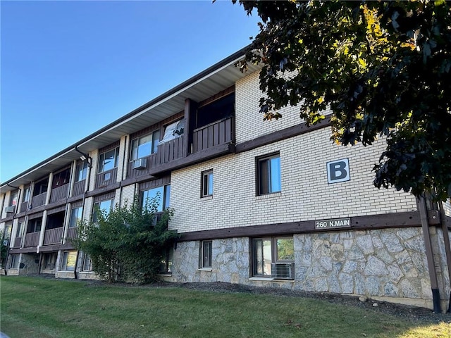 view of building exterior with central AC