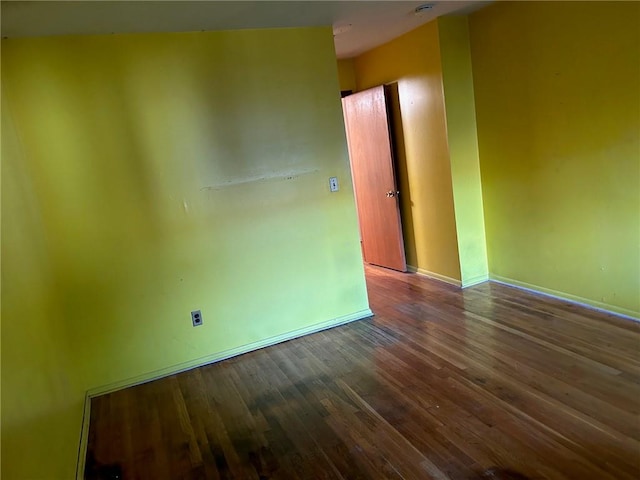 spare room with hardwood / wood-style floors