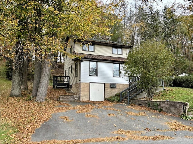 view of front of property with a wooden deck