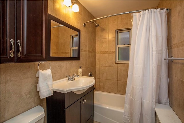 full bathroom with tasteful backsplash, vanity, shower / bathtub combination with curtain, tile walls, and toilet