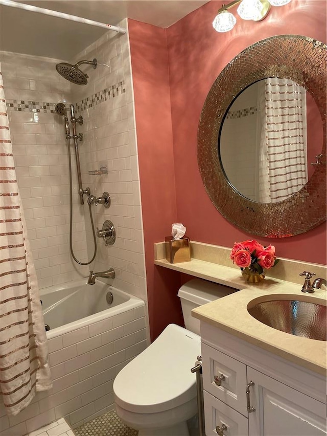 full bathroom with vanity, shower / tub combo, and toilet