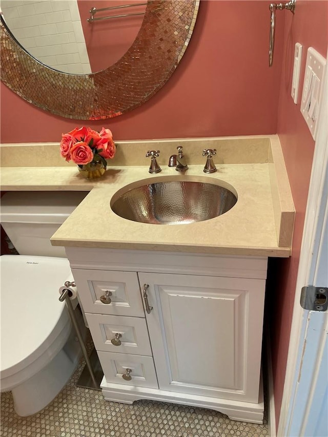 bathroom featuring vanity, toilet, and tile patterned flooring