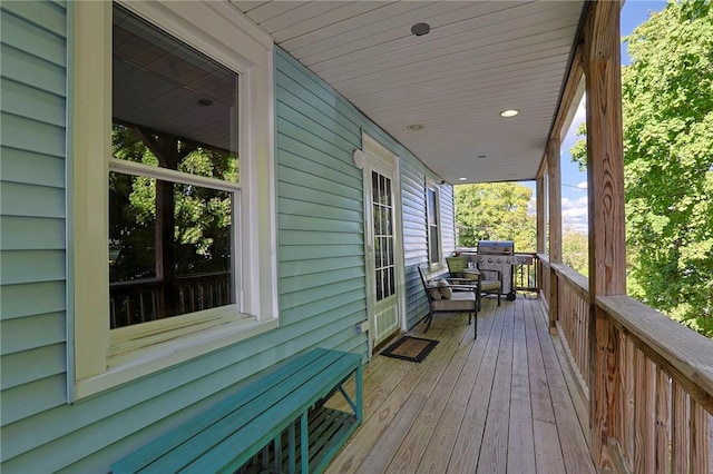 deck featuring area for grilling and a porch