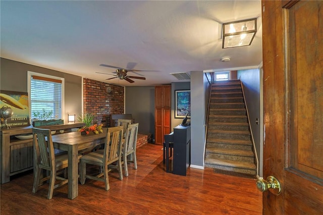 dining space featuring ceiling fan and dark hardwood / wood-style flooring