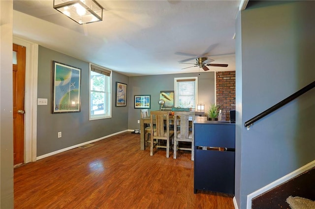 dining space with hardwood / wood-style flooring, ceiling fan, and a wealth of natural light