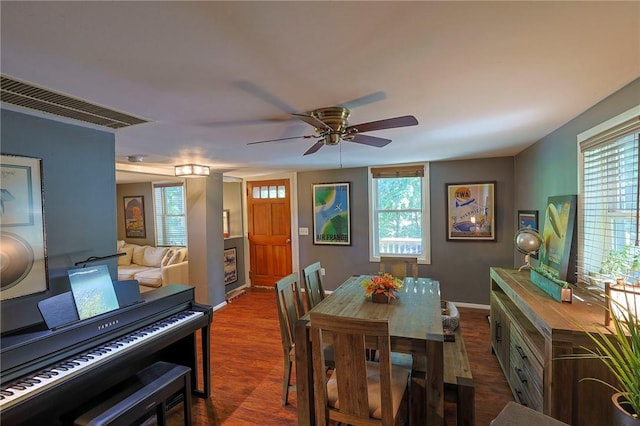 dining room featuring ceiling fan and dark hardwood / wood-style floors