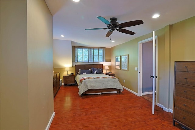 bedroom with hardwood / wood-style floors and ceiling fan