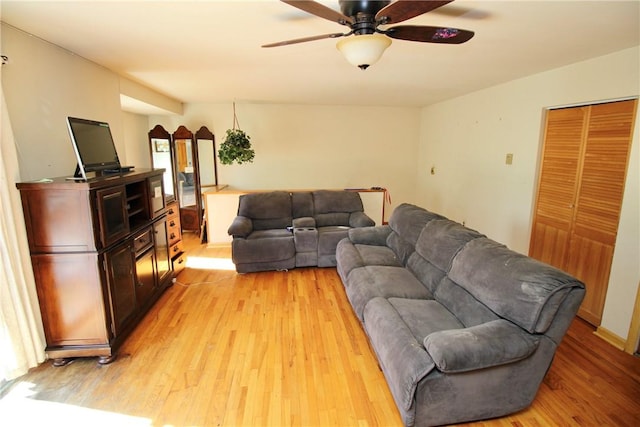 living room featuring ceiling fan and light wood-type flooring