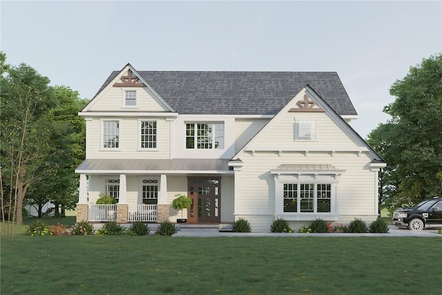 view of front of house featuring covered porch and a front yard