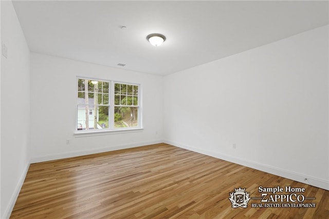 empty room featuring hardwood / wood-style floors