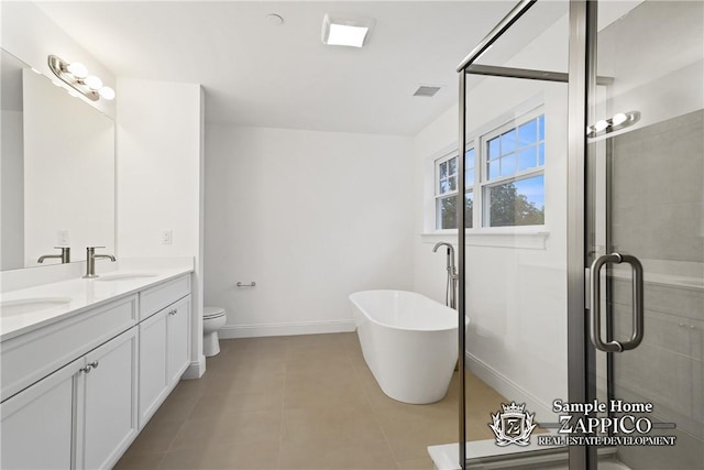 full bathroom with tile patterned floors, plus walk in shower, vanity, and toilet