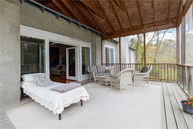 sunroom / solarium with lofted ceiling