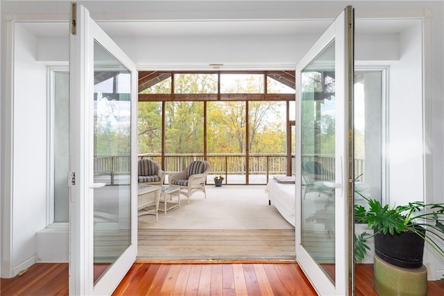 unfurnished sunroom with french doors and a healthy amount of sunlight