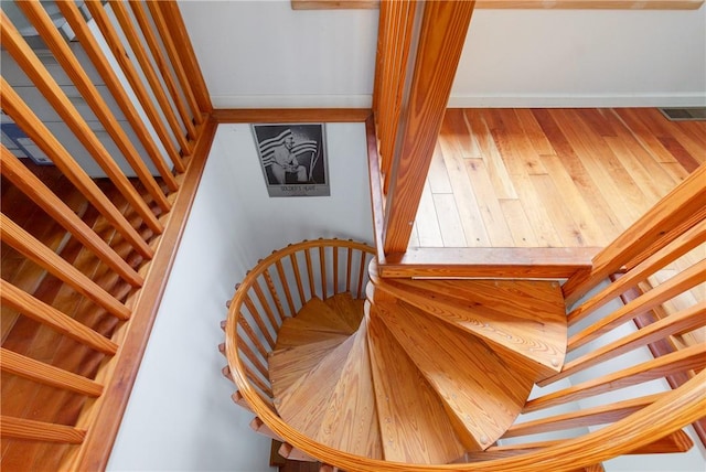 staircase featuring wood-type flooring