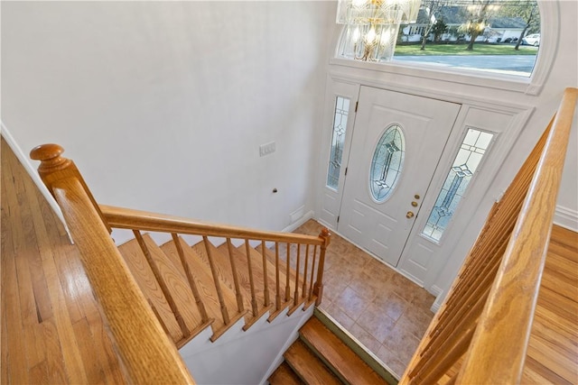 entryway featuring a chandelier and hardwood / wood-style floors