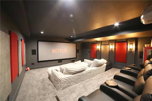 home theater room featuring light colored carpet