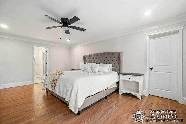 bedroom featuring hardwood / wood-style floors, ceiling fan, crown molding, and connected bathroom