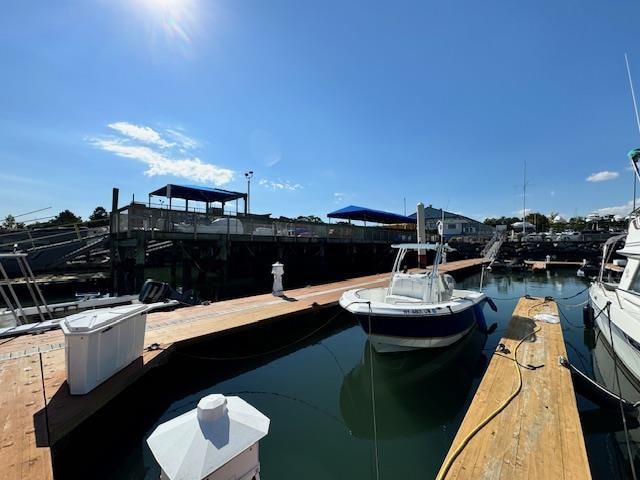 exterior space featuring a dock and a water view