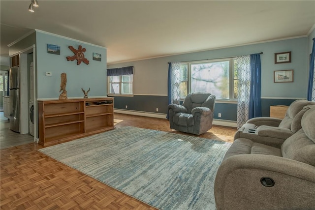 living room with plenty of natural light, light parquet floors, and a baseboard radiator