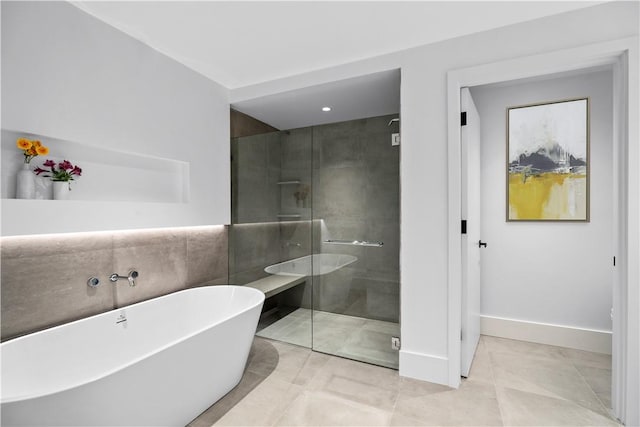 bathroom with tile patterned flooring and plus walk in shower