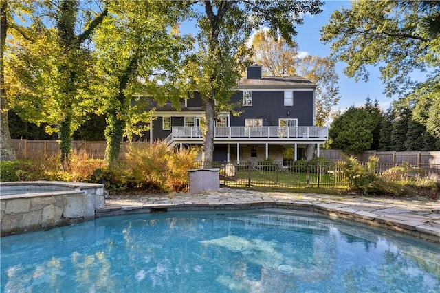 view of pool with fence, a wooden deck, and a fenced in pool