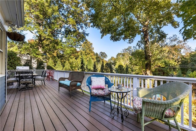 wooden terrace featuring outdoor dining space