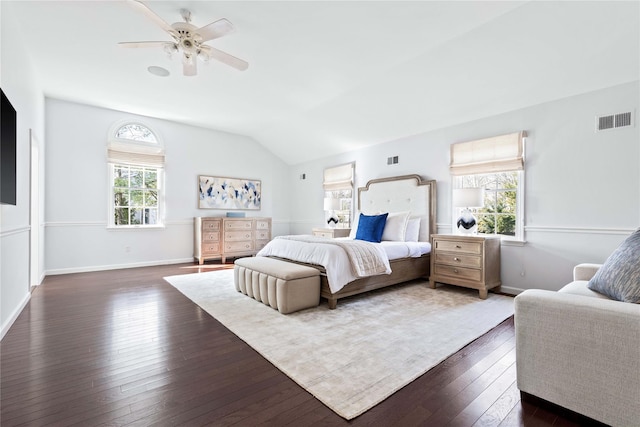 bedroom featuring lofted ceiling, a ceiling fan, visible vents, baseboards, and dark wood-style floors