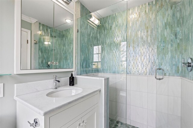 full bathroom featuring a shower stall and vanity