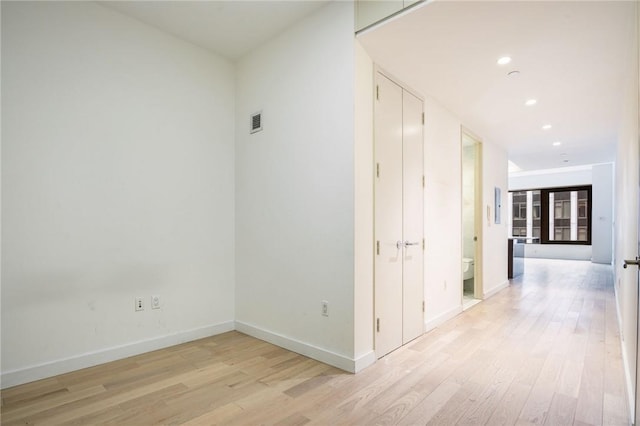 hall with light wood-type flooring