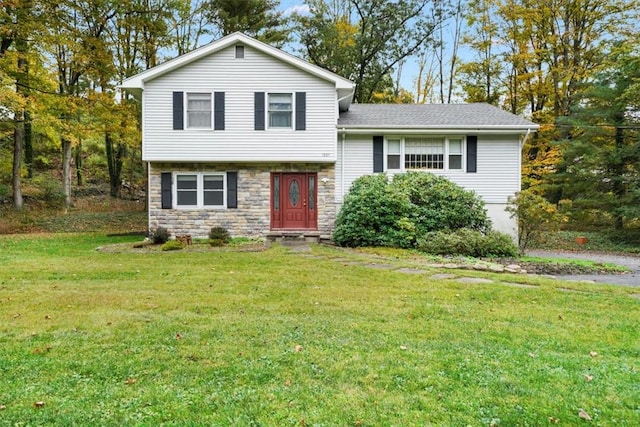 split level home featuring a front yard