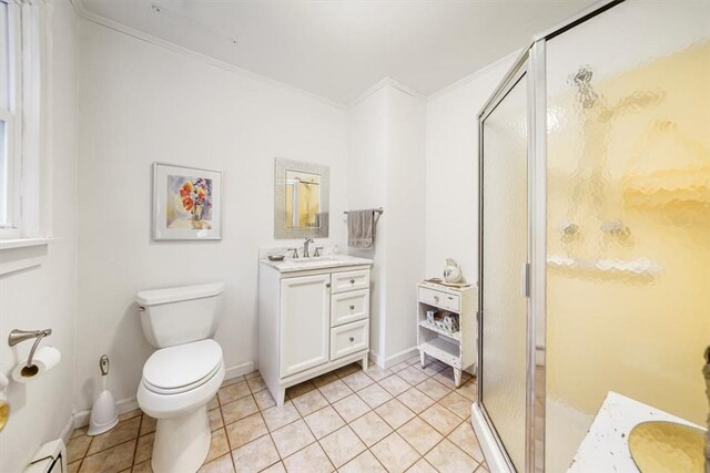 bathroom with ornamental molding, vanity, a baseboard radiator, tile patterned flooring, and a shower with shower door