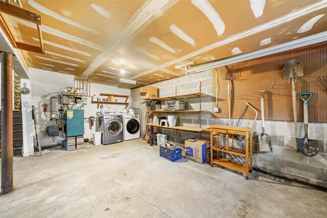 basement featuring separate washer and dryer and a workshop area