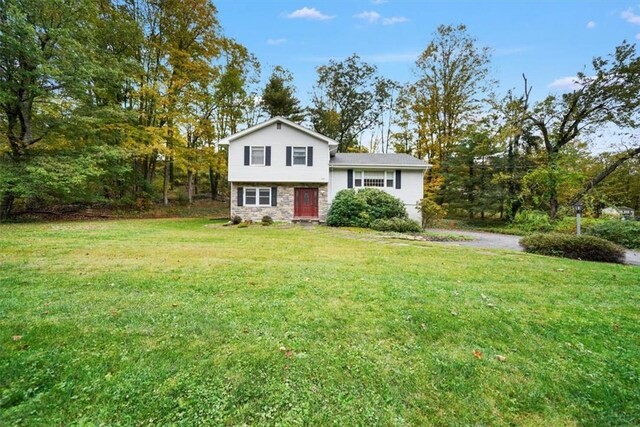 split level home with a front yard