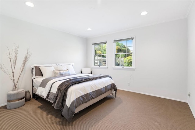 bedroom featuring carpet flooring and crown molding