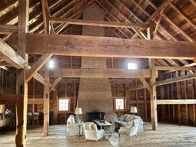 interior space with a wealth of natural light, beamed ceiling, and high vaulted ceiling