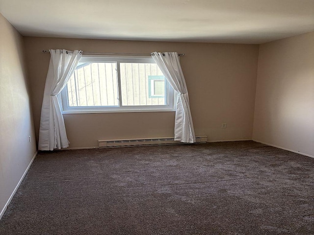 additional living space with dark colored carpet and a baseboard heating unit