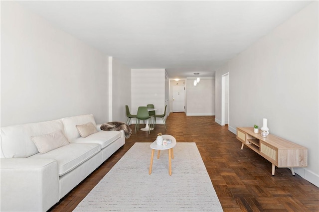 living room featuring dark parquet floors