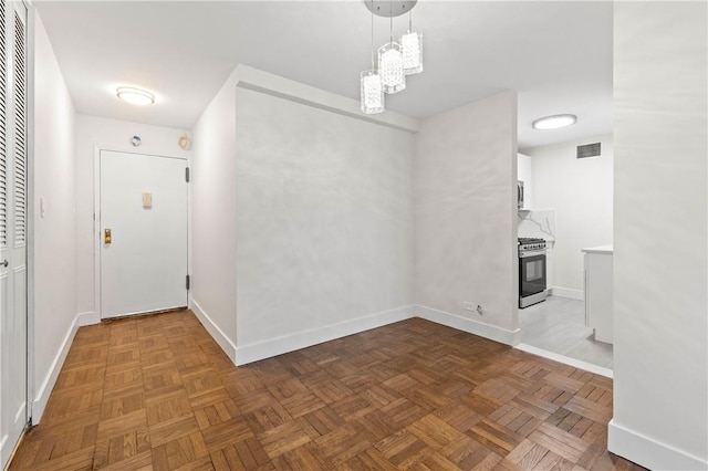 entrance foyer featuring dark parquet floors