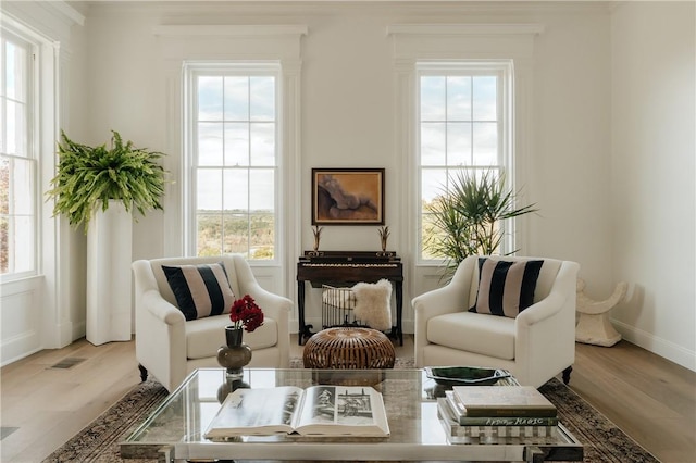 sitting room featuring light hardwood / wood-style flooring and plenty of natural light