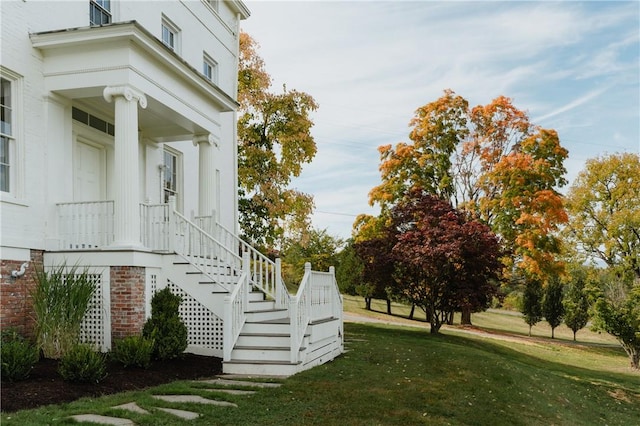 view of property exterior with a yard