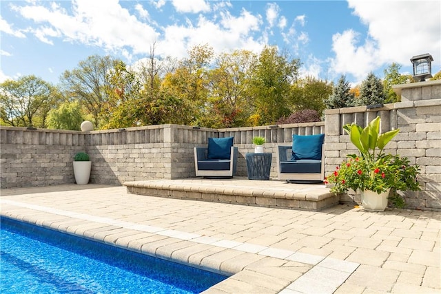 exterior space with a fenced in pool