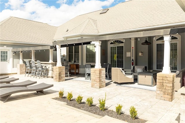 view of patio / terrace featuring exterior bar and outdoor lounge area