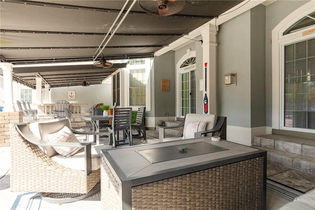 view of patio / terrace featuring ceiling fan