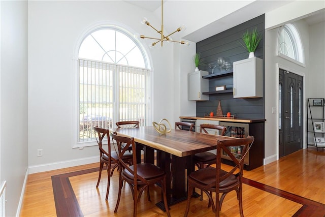 dining room featuring light hardwood / wood-style flooring and a healthy amount of sunlight