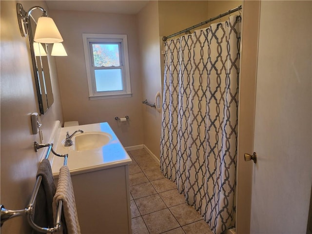 bathroom featuring tile patterned flooring, vanity, and a shower with curtain