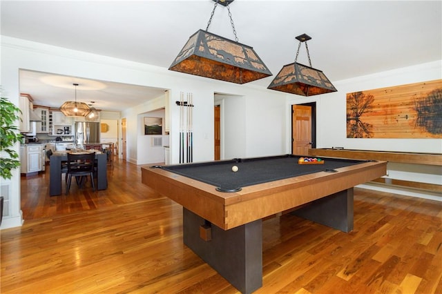 game room with wood-type flooring and billiards